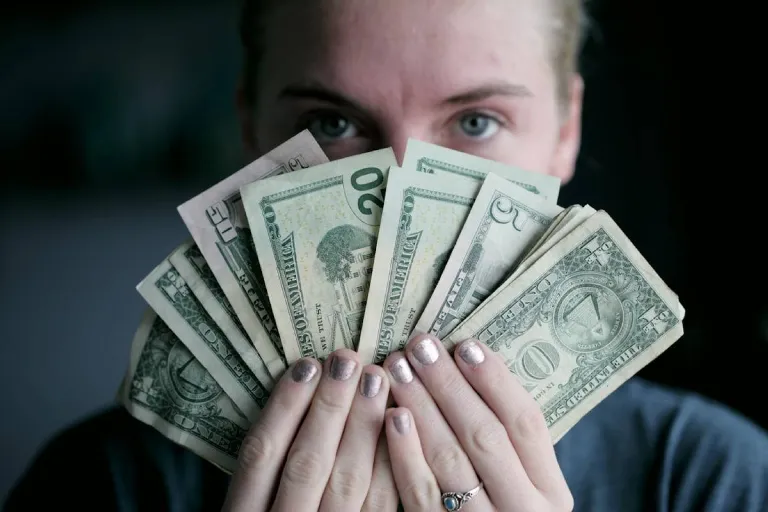 Investor holding banknotes
